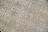 Worn, distressed pile of vintage Oushak rug, showing foundation and knot heads.