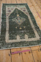 Distressed ornamented lantern motif with foundation showing on dusty charcoal teal.