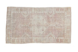 Hand-knotted distressed Oushak rug with faded hexagonal medallion, dusty rose and ivory.
