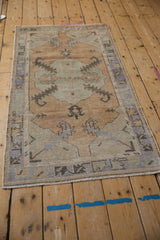 Vintage distressed Oushak runner, serrated leaf motifs in muted tones.