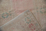 Hand-knotted foundation and secured side cord detail of the vintage distressed Turkish Oushak rug.