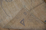 Reverse view of vintage Oushak runner, showing blue processing marks and natural hand-knotted foundation.