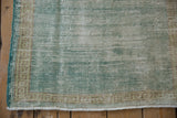 Distressed vintage Oushak rug corner, mint green field, exposed foundation, running-t border, selvage.