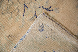 Vintage distressed Oushak rug foundation with visible knot heads and blue side cord.