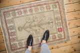 Distressed Oushak rug, tree of life motif, geometric raspberry flowers, and oxidized silver field.