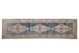 Vintage Distressed Oushak rug runner with abrashed dusty teal field, ivory medallions, cochineal red florals, 3' x 11'.