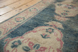 Distressed Oushak runner with scalloped ivory medallion and dusty aqua teal field.
