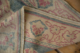Hand knotted Oushak rug pile and foundation with dusty aqua teal, pale burgundy pattern.