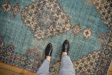 Textured distressed powder blue Sparta rug with traditional patterns, underfoot.