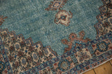 Distressed vintage Sparta rug, mostly even wear on turquoise field, ivory pomegranate border.