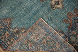 Distressed turquoise pile with foundation showing, and patterned reverse of the vintage Sparta rug.