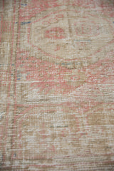 Low pile of a distressed Turkish rug showing mostly even wear across the knot heads.