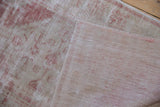 The hand-knotted foundation and reverse side of a distressed vintage Turkish Oushak rug.