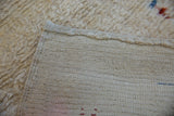 Hand-knotted cream foundation and original selvedge detail of the vintage Tulu rug.