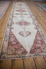 Angled view of the long Sparta runner, emphasizing the repeating medallion design and distressed texture.
