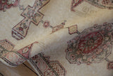 Close-up on the soft, distressed texture and low pile of a vintage Turkish Sparta runner.