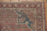 Anatolian rug corner, dusty sapphire samovar spandrel, mauve rose field, aged texture.