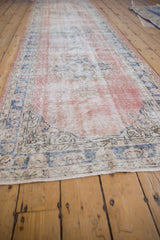 Blush and dusty cobalt distressed Sparta runner with worn pile and border.
