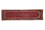 Vintage Anatolian rug runner with a cherry red field and an allover geometric samovar panel design.
