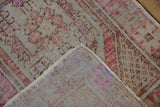 Distressed vintage Oushak rug pile, revealing knot heads and woven reverse.