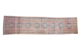 Distressed Vintage Oushak runner with dusty pink field, cobalt blue medallions, and visible wear, 2'11