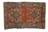 Early 20th century Karaja rug with double medallions, primitive design, brick red and sapphire blue.