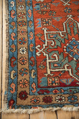 Vintage Karaja rug corner, showing sapphire blue boteh border and brick red serrated palmette.