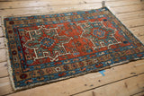 Vintage Karaja rug corner with secure fringe, sapphire blue and brick red boteh borders.