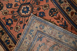 Hand-knotted foundation and short pile of the vintage Mehreban rug with dusty blush floral field.