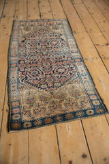 Vintage Farahan Sarouk rug end with detailed shrub design in saffron, ivory, and dusty blue.
