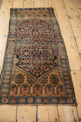 Vintage Farahan Sarouk rug detail: Herati pattern, sapphire blue abrashes, terracotta tones.