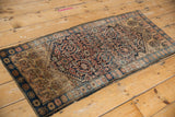 Vintage Farahan Sarouk rug corner, detailed Herati pattern, dusty navy border, original selvage.
