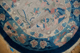 Curved vintage Art Deco rug, cobalt blue border and ornate pink, blue blossoms.