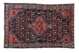 Vintage Tajabad rug, hexagonal medallion, boteh and vinery pattern, navy blue and faded cherry red.