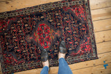 Hand-knotted Persian Tajabad rug corner, navy field with colorful botehs and ivory border.