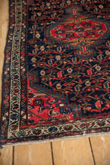 Vintage Persian Tajabad rug showcasing ivory border and navy field with scrolling red botehs.