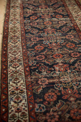 Vintage Hamadan runner: creamy henna plant border and worn navy Herati field.