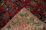 Vintage Sarouk rug: detailed cherry red palmette pile and patterned hand-knotted foundation.