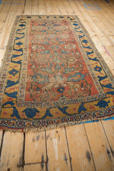 Antique Halvai Bijar rug corner: rare saffron yellow border, cobalt blue vine, tattered fringe.