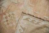 Distressed Oushak rug pile texture with abrash, fringe, and geometric reverse weave.