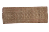 Distressed vintage Afghani Bokhara runner, muted beige and sand with pale pink double column guls, 2'2