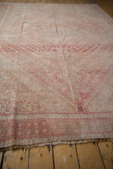 Hand knotted distressed Shiraz end, with even wear and faint foundation, in blush and beige.