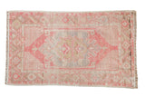 Distressed vintage Oushak rug, oversize medallion, geometric florals, pink, silver, gold. 2'7