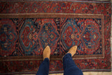 Vintage Mehreban rug with raspberry red cloudbands, cobalt blue medallions, and floral vine border.