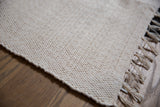 Organic cotton rag rug, natural undyed with soft, textured weave.