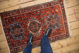A view from above showing the scale of a vintage Persian Karaja rug's geometric design.
