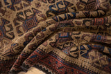 Draped folds of a vintage Belouch rug showing its plush pile and hook-and-latch gul design.