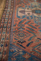 Vintage Malayer rug with continuous boteh border and dusty brick red field, aqua blue Herati motifs.