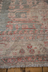Evenly worn pile of Vintage Distressed Oushak carpet, slate blue, dusty rose vine border.