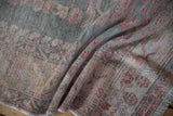 Vintage Oushak rug's distressed pile texture, abrash, slate blue, and dusty rose hues.